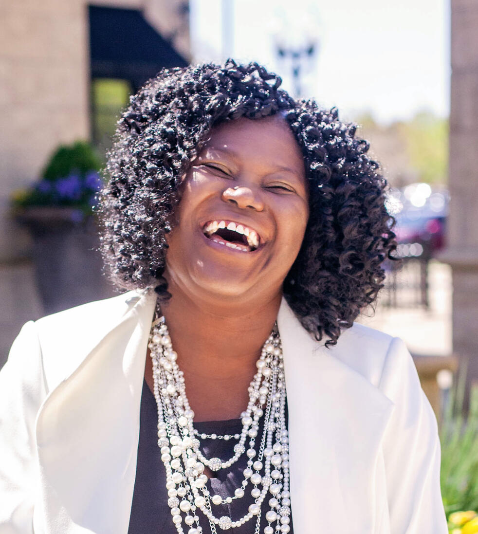 Headshot of voiceover artist Brittany V. Smalls smiling and showing personality.